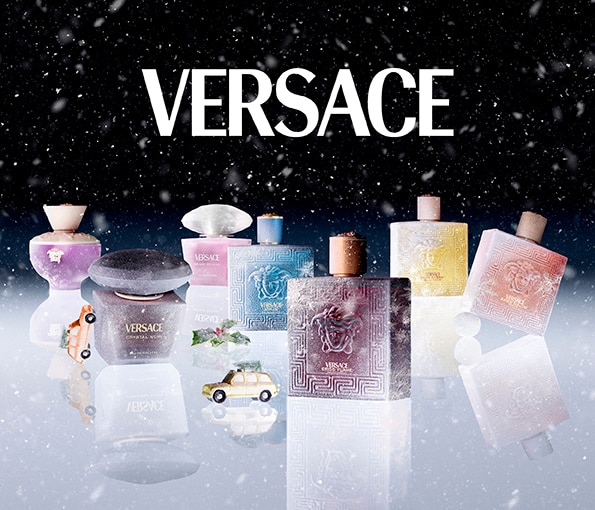 Versace luxus parfüm kollekció ünnepi kiadásban, elegáns üvegek hóeséses háttér előtt.